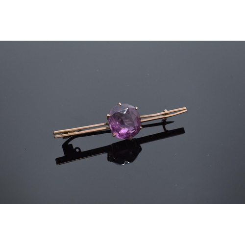 217 - 9ct gold ladies brooch set with an amethyst stone with a base metal pin. 4.6 grams gross weight. Sma... 