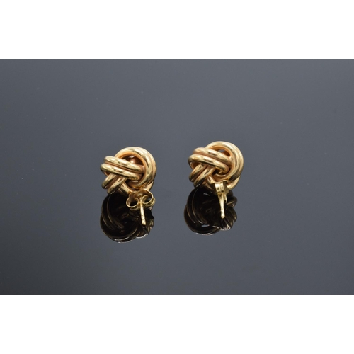 218 - A pair of 9ct gold earrings. 2.8 grams weight. Marks to the stem.