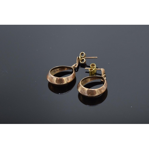 219 - A pair of 9ct gold earrings in an oval shape. 2.1 grams. Full hallmarks to interior.