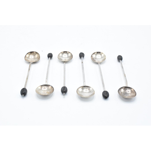 222 - A set of 6 silver tea spoons with a leather effect bobble. 41.3 grams gross weight. Birmingham 1923.