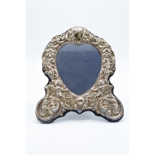 225 - A hallmarked silver fronted picture frame with a cherub design. Hallmarked for Birmingham 1996- make... 