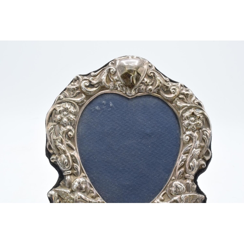 225 - A hallmarked silver fronted picture frame with a cherub design. Hallmarked for Birmingham 1996- make... 