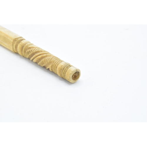 229 - 19th century carved ivory parasol handle: Measures 15.25 cm long.  Chipping to bottom turning