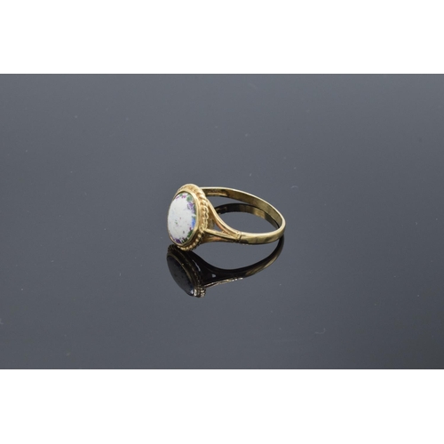 233 - 9ct gold ring set with a oval stone. 2.5 grams gross weight. UK size S. Full hallmarks.