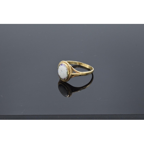 233 - 9ct gold ring set with a oval stone. 2.5 grams gross weight. UK size S. Full hallmarks.