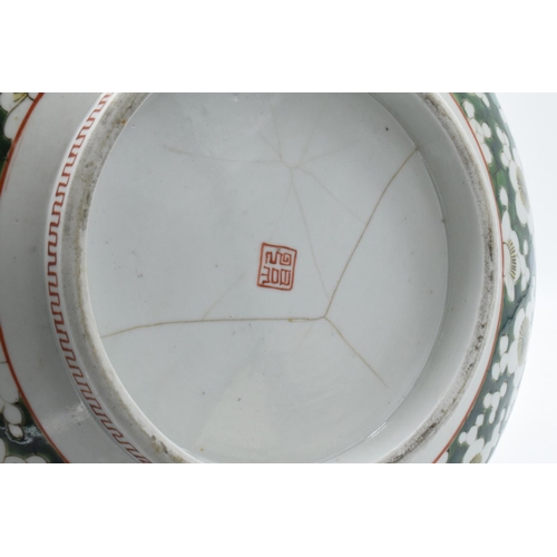 24 - A large late 19th/ early 20th century Japanese thick porcelain bowl with a floral green design. Show... 