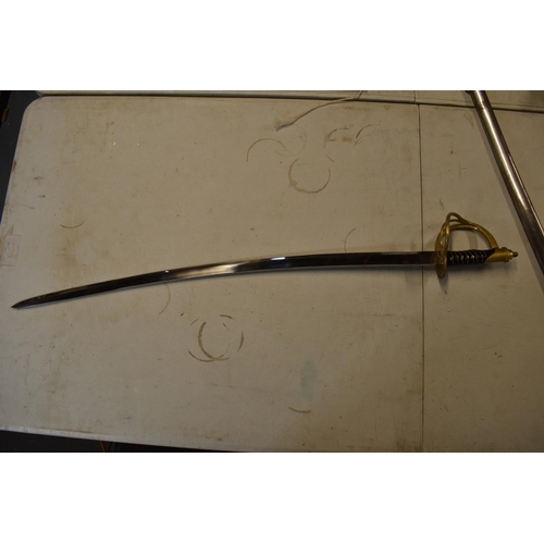 240 - A reproduction sword in the style of a 19th century military sword. 109cm in length with metal sheaf... 