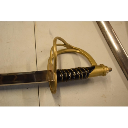 240 - A reproduction sword in the style of a 19th century military sword. 109cm in length with metal sheaf... 