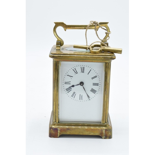 241 - 19th century brass carriage clock with an enamel face and a single train movement in a leather trave... 