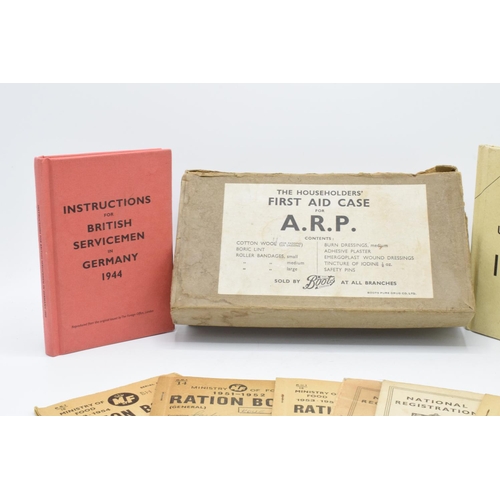 243 - An interesting grouping of WWII memorabilia & ephemera: Comprises ARP first aid kit with various ite... 