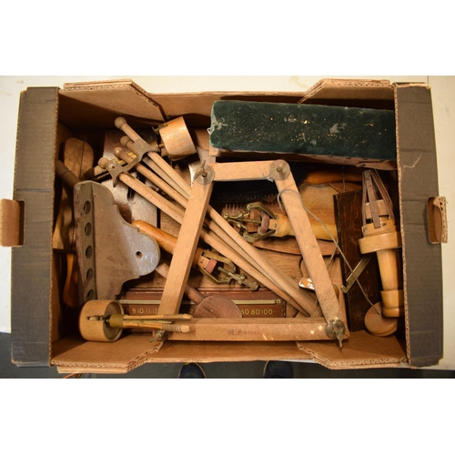 246 - A mixed collection of antique and vintage wooden items to include a trouser press, tools, chopping b... 