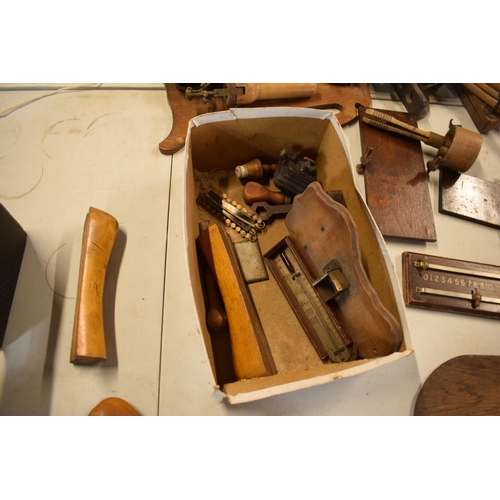 246 - A mixed collection of antique and vintage wooden items to include a trouser press, tools, chopping b... 