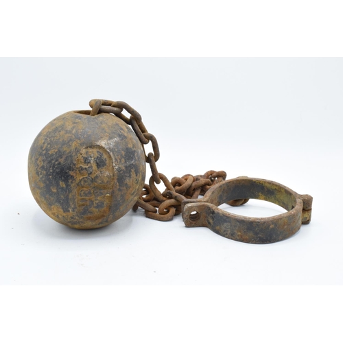 251 - Antique 19th century cast iron prisoner's ball and chain. Working clasp. Signs of corrosion and rust... 