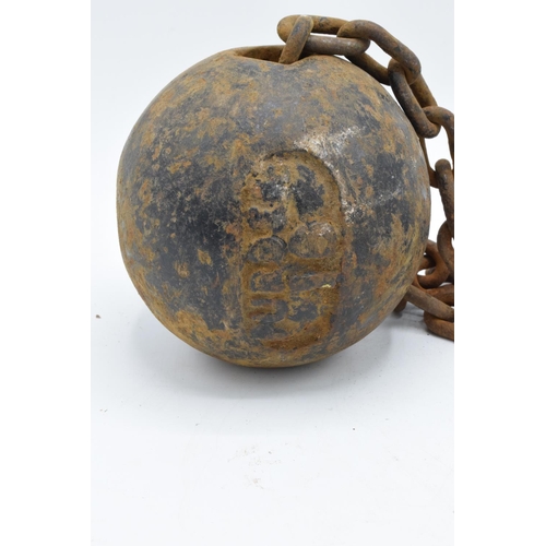 251 - Antique 19th century cast iron prisoner's ball and chain. Working clasp. Signs of corrosion and rust... 