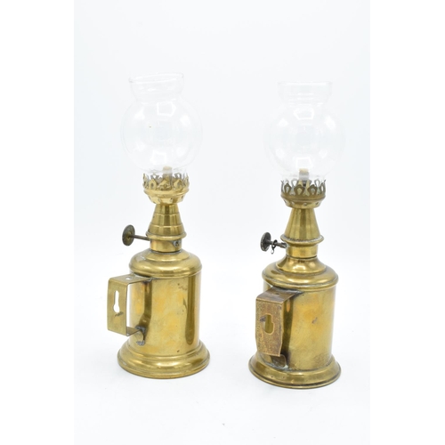 255 - A French brass lamp Une Lampe Pigeon together with a similar item Lampe Feautree Olympe (2). With as... 