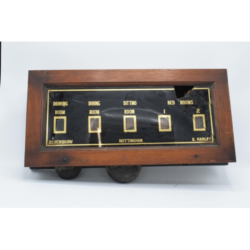 268 - A late 19th/ early 20th century butlers bell box in a wooden frame together with 2 wall mounted butt... 