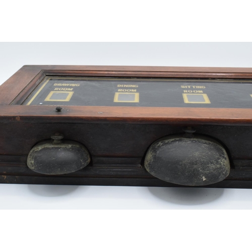 268 - A late 19th/ early 20th century butlers bell box in a wooden frame together with 2 wall mounted butt... 