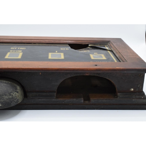 268 - A late 19th/ early 20th century butlers bell box in a wooden frame together with 2 wall mounted butt... 