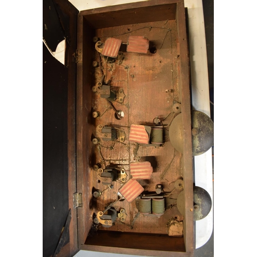 268 - A late 19th/ early 20th century butlers bell box in a wooden frame together with 2 wall mounted butt... 