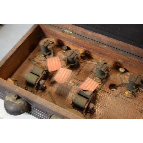 268 - A late 19th/ early 20th century butlers bell box in a wooden frame together with 2 wall mounted butt... 