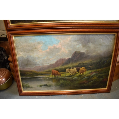 269 - A pair of oils on canvases depicting highland cattle amongst mountainous scenes both signed by E Hea... 