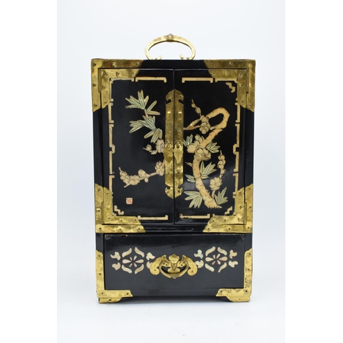 273 - A 20th century Chinese lacquer-style jewellery box with fold and doors and pull out drawers. In good... 