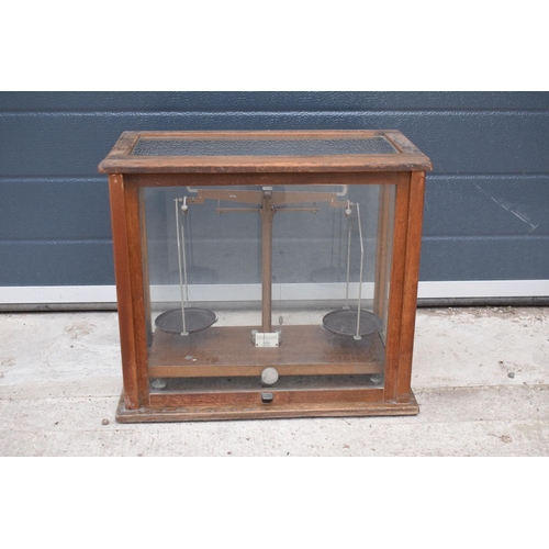 276 - A early-mid 20 century wooden cased set of laboratory scales made WBN of Glasgow. Sold as decorative... 