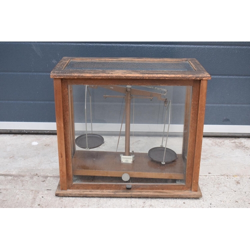 279 - A early-mid 20 century wooden cased set of laboratory scales made WBN of Glasgow. Sold as decorative... 