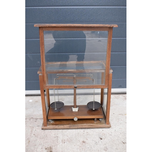 279 - A early-mid 20 century wooden cased set of laboratory scales made WBN of Glasgow. Sold as decorative... 