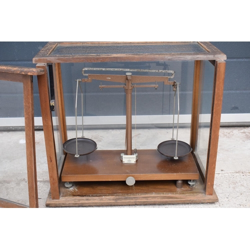 279 - A early-mid 20 century wooden cased set of laboratory scales made WBN of Glasgow. Sold as decorative... 