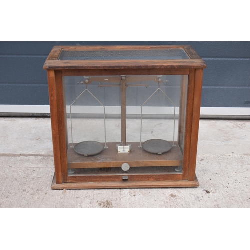 280 - A early-mid 20 century wooden cased set of laboratory scales made WBN of Glasgow. Sold as decorative... 