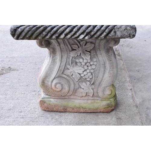 286 - A vintage garden ornament in the form of a bench with supports with grape and vines decoration, 112c... 