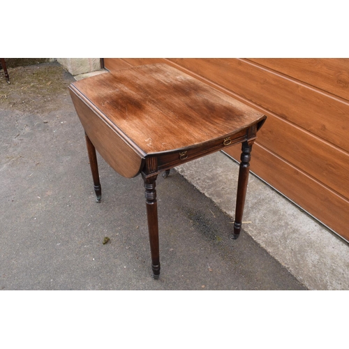 287 - 19th century light mahogany Pembroke table on casters with a single draw and a faux drawer at the op... 