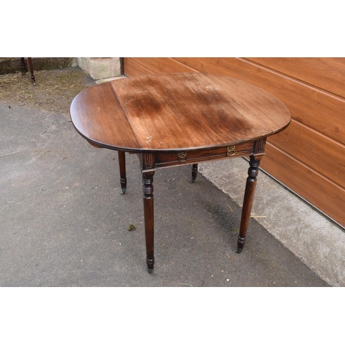 287 - 19th century light mahogany Pembroke table on casters with a single draw and a faux drawer at the op... 