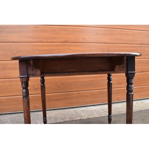 287 - 19th century light mahogany Pembroke table on casters with a single draw and a faux drawer at the op... 