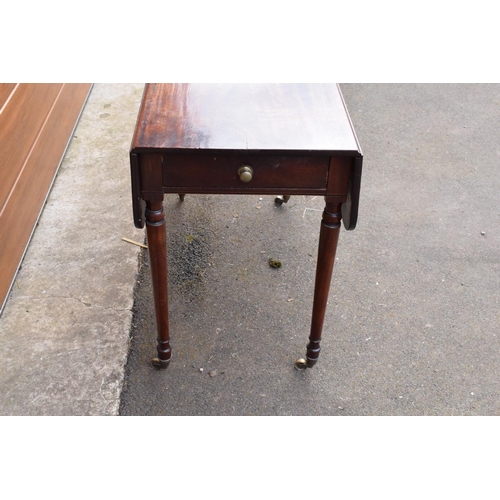 288 - 19th century mahogany Pembroke table on casters with a single draw. In good functional condition. So... 