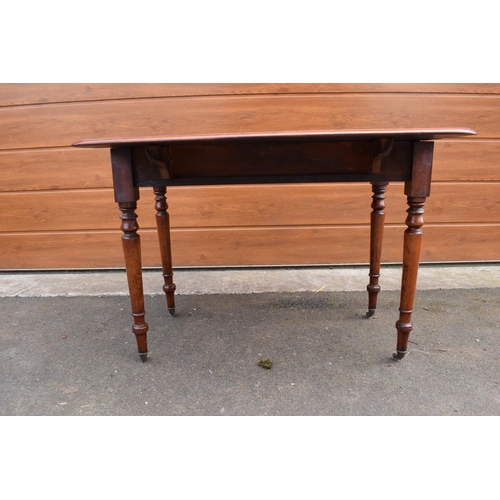 289 - Late 19th century mahogany Pembroke table on casters with a single hidden draw. In good functional c... 