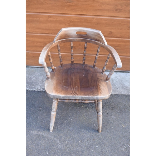 290 - A reproduction wooden captains chair. 76cm tall. In good sturdy condition with some marks, water sta... 