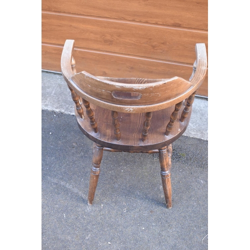 290 - A reproduction wooden captains chair. 76cm tall. In good sturdy condition with some marks, water sta... 