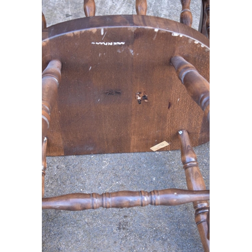 292 - A reproduction wooden captains chair. 76cm tall. In good sturdy condition with some marks, water sta... 