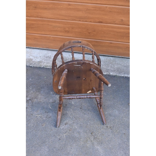 292 - A reproduction wooden captains chair. 76cm tall. In good sturdy condition with some marks, water sta... 