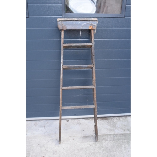 300 - A pair of vintage wooden ladders. Both are rickety and need attention. Signs of old worm. One missin... 