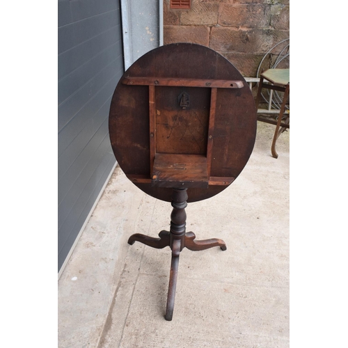 304 - Georgian thick oak oval tilt top table with later Victorian carving depicting fruit scenes. 84 x 72 ... 