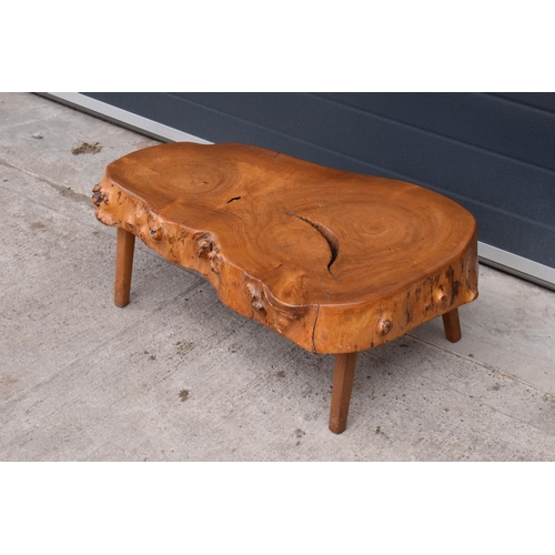 306 - Mid century tree slice coffee table. 82 x 50 x 29cm. Some knocks and scratches with general wear as ... 