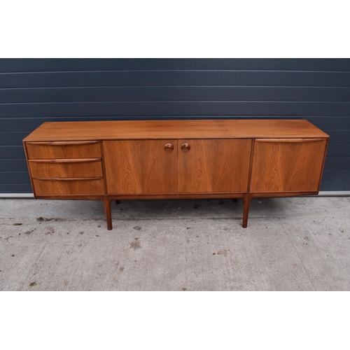 310 - A.H. Mcintosh Of Kirkcaldy retro 1960s teak sideboard raised on tapered legs. Approx 208 x 46 x 76cm... 