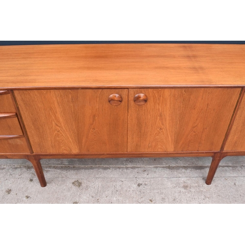 310 - A.H. Mcintosh Of Kirkcaldy retro 1960s teak sideboard raised on tapered legs. Approx 208 x 46 x 76cm... 