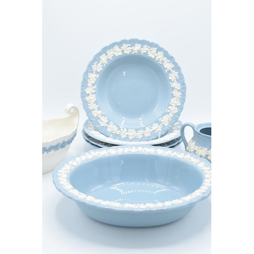 63 - Wedgwood Embossed Queen's Ware to include a sugar pot (no lid), 4 8 1/4 '' bowls and an oval vegetab... 