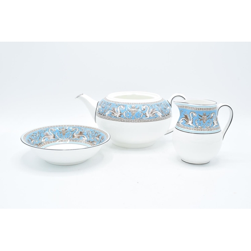 67 - A collection of Wedgwood Florentine tea and dinner ware to include a tea pot (no lid), a creamer, a ... 