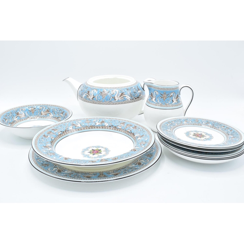 67 - A collection of Wedgwood Florentine tea and dinner ware to include a tea pot (no lid), a creamer, a ... 