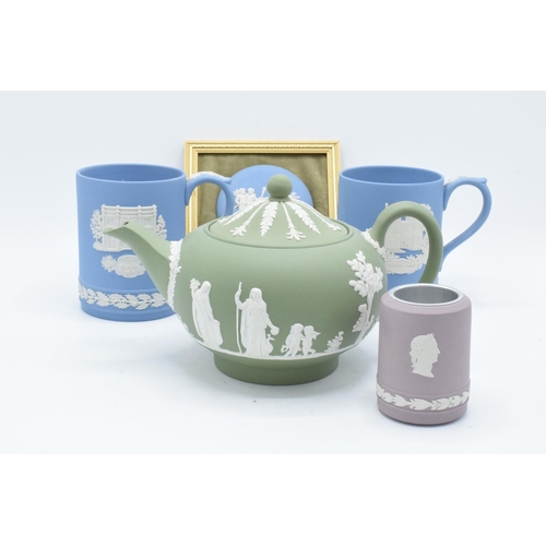 76 - A collection of Wedgwood Jasper ware to include a lilac vase/ table lighter, a sage green teapot (sp... 